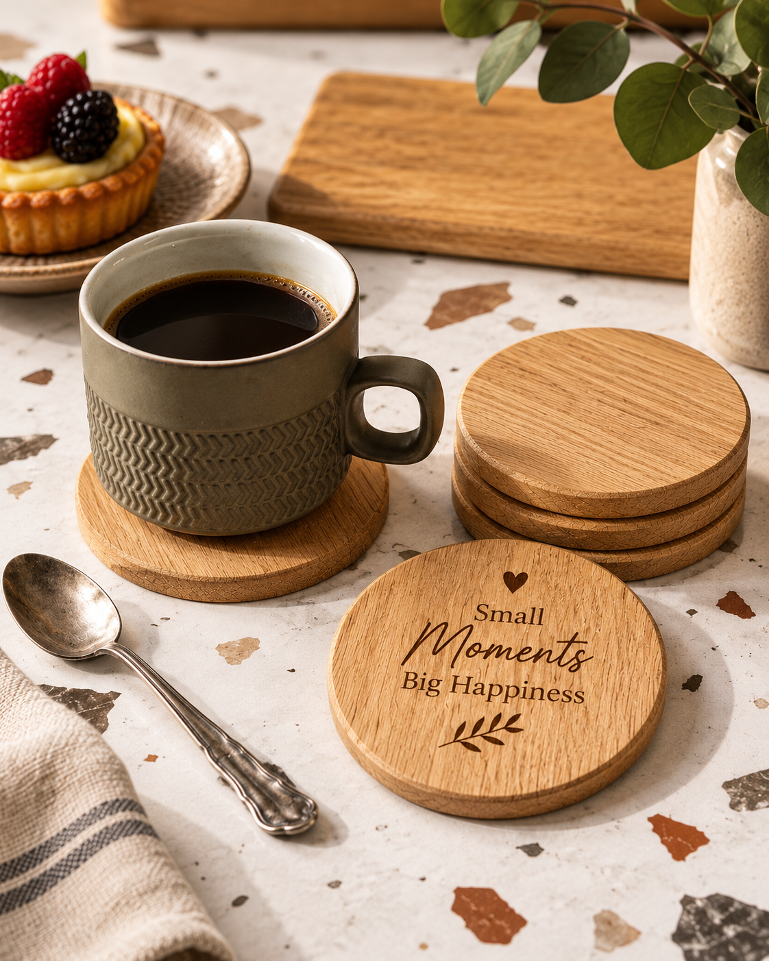Personalised oak coaster set with Small Moments Big Happiness engraving beside coffee