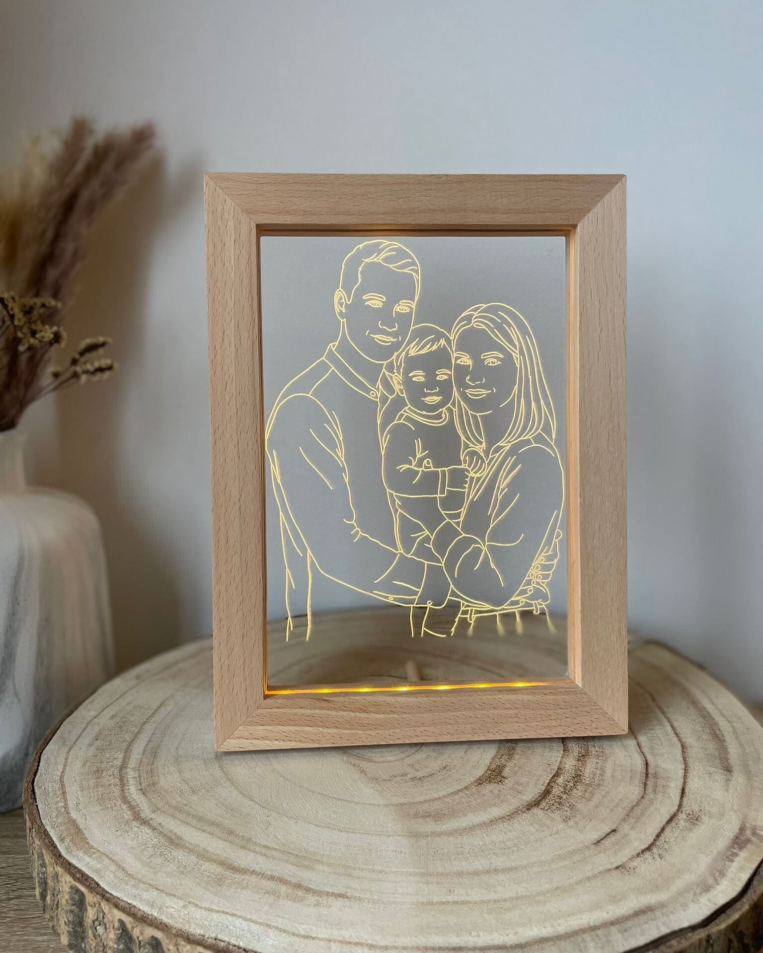 AtaNova StoryFrame ingelijste lijnkunst fotolamp op een nachtkastje