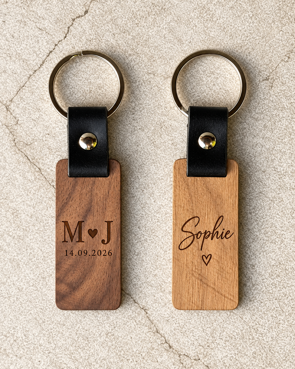 Oak and American walnut personalised wooden keychains with genuine leather straps and laser engraved designs